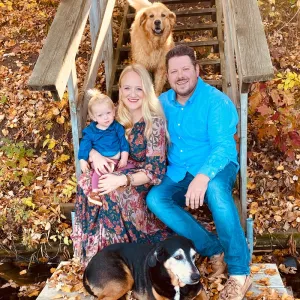Dr. Joseph Lindberg with his wife, daughter, and two dogs